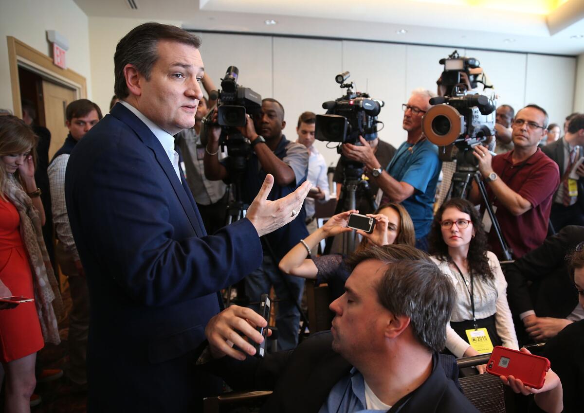 Presidential candidate Ted Cruz speaks with reporters at the Republican National Committee meeting in Hollywood, Fla. Party leaders say they don’t plan any substantial changes in convention rules.