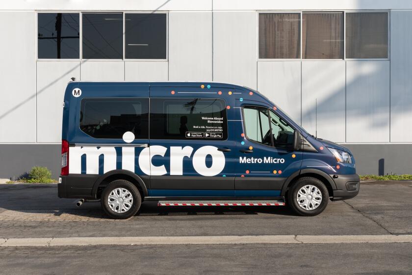A blue Metro Micro van 