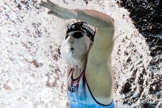 Katie Ledecky, of the United States, competes in the women's 1500-meter freestyle final at the 2024 Summer Olympics, Wednesday, July 31, 2024, in Nanterre, France. Ledecky won gold setting a new Olympic record. (AP Photo/David J. Phillip)