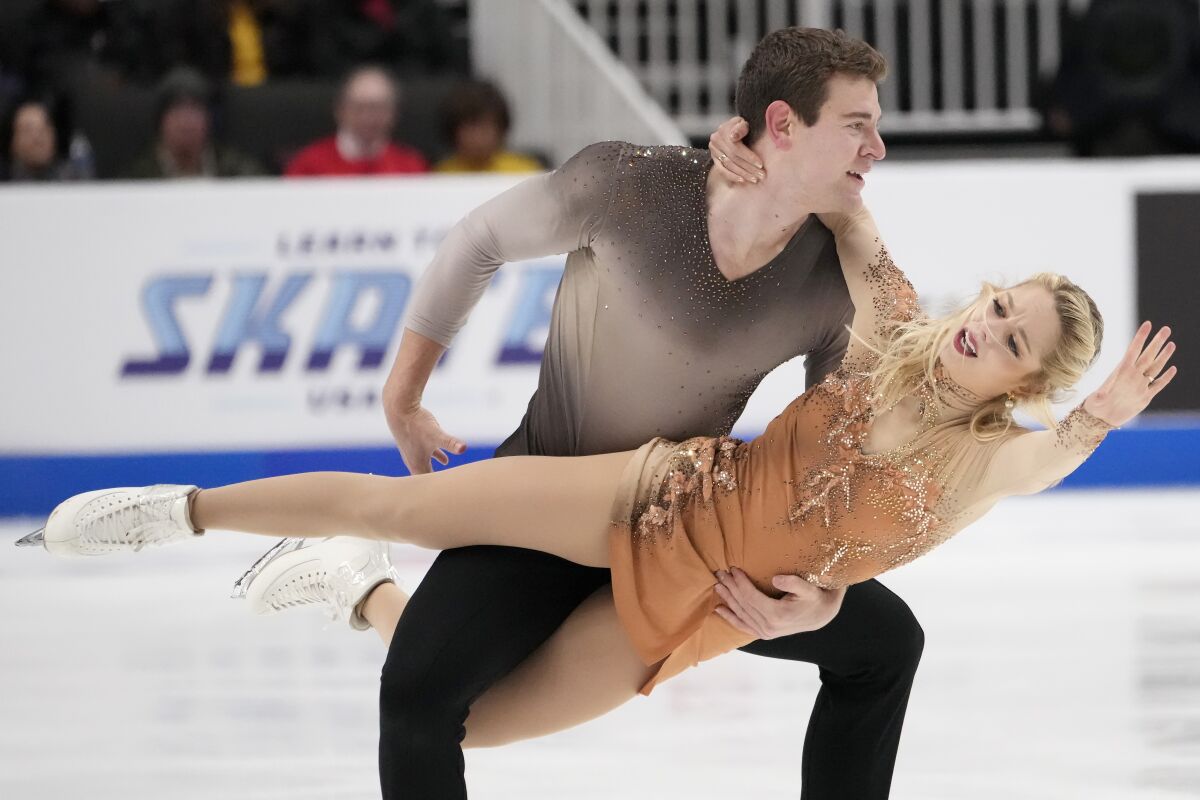 Brandon Frazier, top, and Alexa Knierim perform during the pairs free skate.
