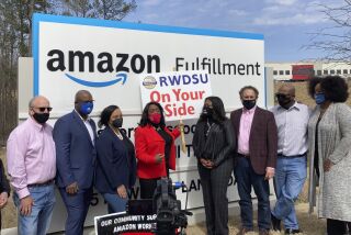 FILE - Democratic members of Congress join representatives of the Retail, Wholesale and Department Store Union gather outside an Amazon fulfillment center in Bessemer, Ala., on March 5, 2021, to advocate for the ongoing unionization vote at the sprawling campus. An Amazon worker in Alabama that has been vocal in unionization efforts, has been terminated by the company, according to the Retail, Wholesale and Department Store Union, Friday, June 2, 2023.. (AP Photo/Bill Barrow)