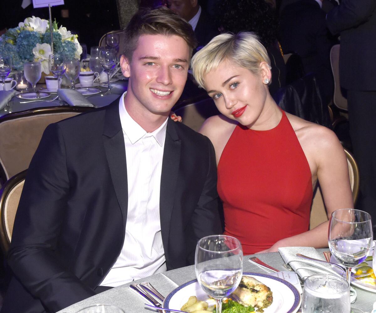 A felony investigation is underway into the ramming of a car driven by model Patrick Schwarzenegger, shown with girlfriend Miley Cyrus.