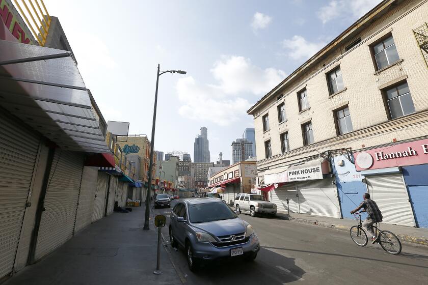 LOS ANGELES, CALIF. - APR. 2, 2020. Shops along Winston Steet in the wholesale district of Los Angeles have suspended business as a precaution against spreading the novel coronavirus. (Luis Sinco/Los Angeles Times)