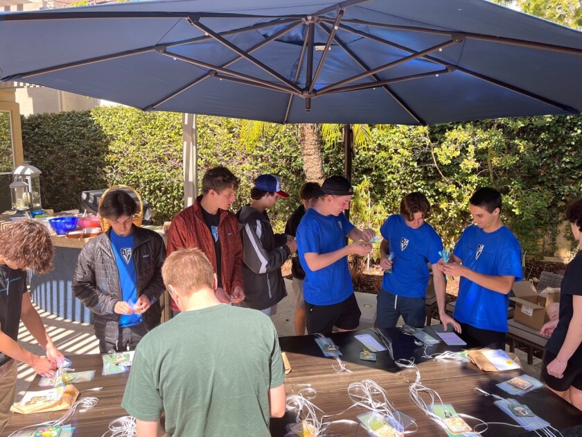 TVIA-2 members making hand-written birthday cards and gift bags for PALS.