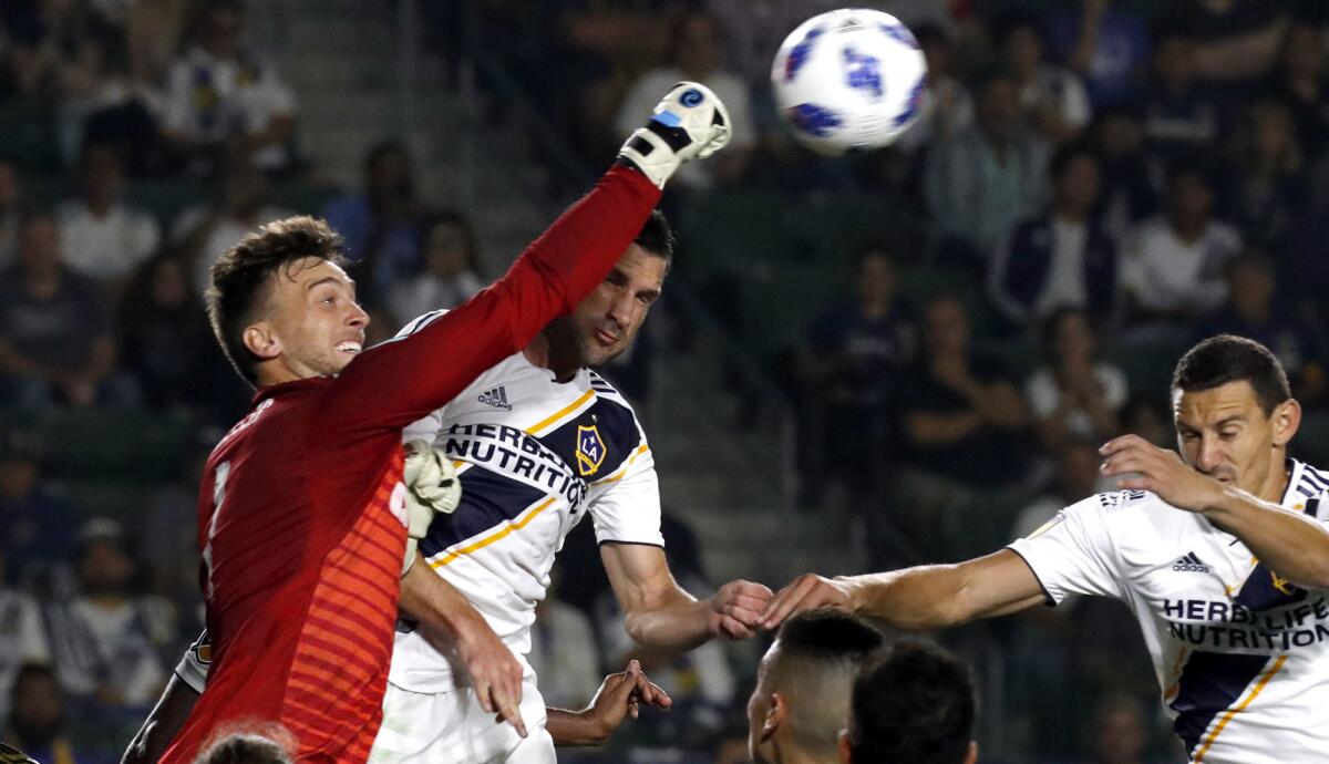 LAFC goalkeeper Tyler Miller punches the ball out of the box against the Galaxy during the second half of a game Aug. 24 at StubHub Center.