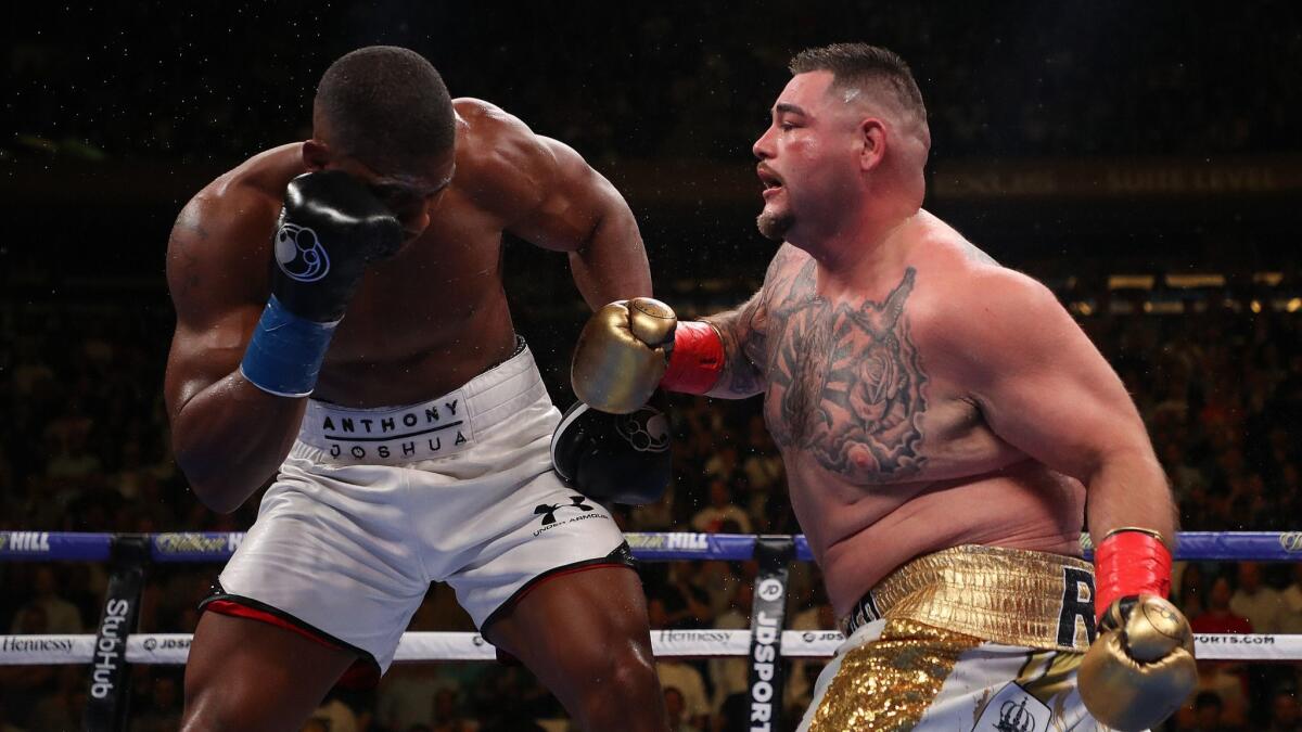 Andy Ruiz Jr., right, punches Anthony Joshua during their heavyweight title fight in New York on June 1. Ruiz won by TKO in an upset.