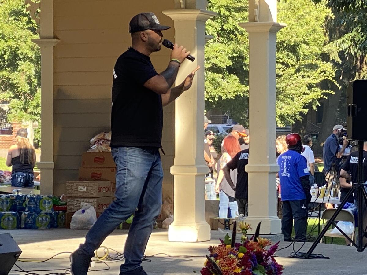 Patriot Prayer leader Joey Gibson speaks in Vancouver, Wash., at a memorial for slain follower Aaron "Jay" Danielson.