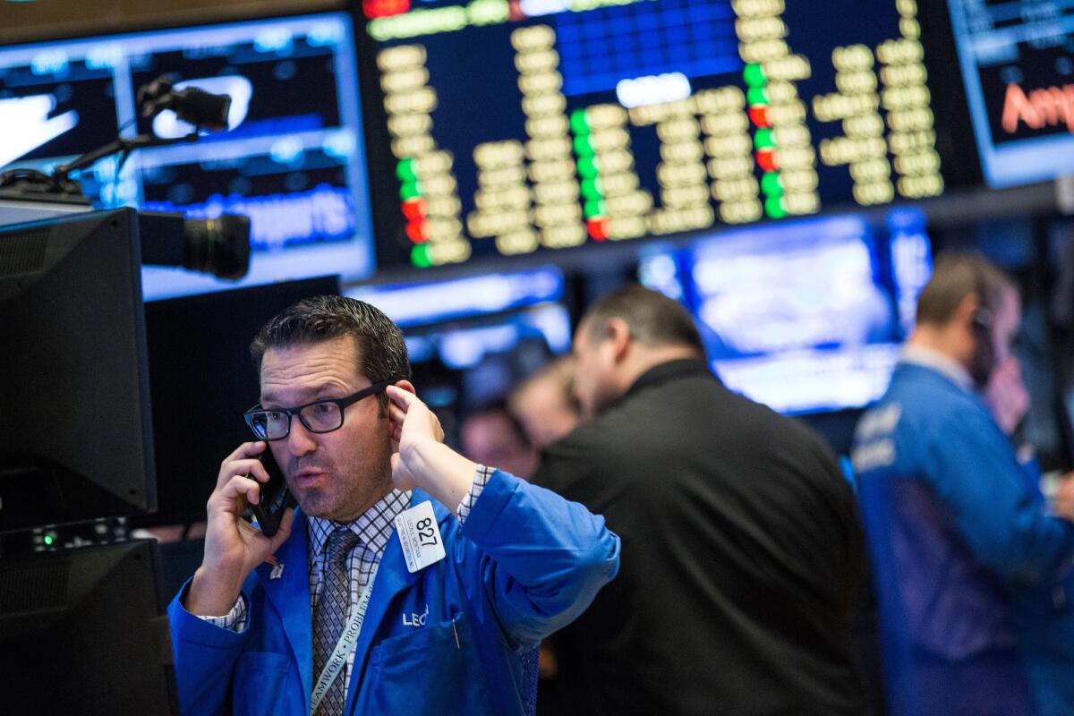 A trader works on the floor of the New York Stock Exchange on Friday morning.