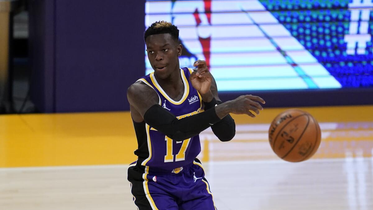 Lakers point guard Dennis Schroder passes the ball.
