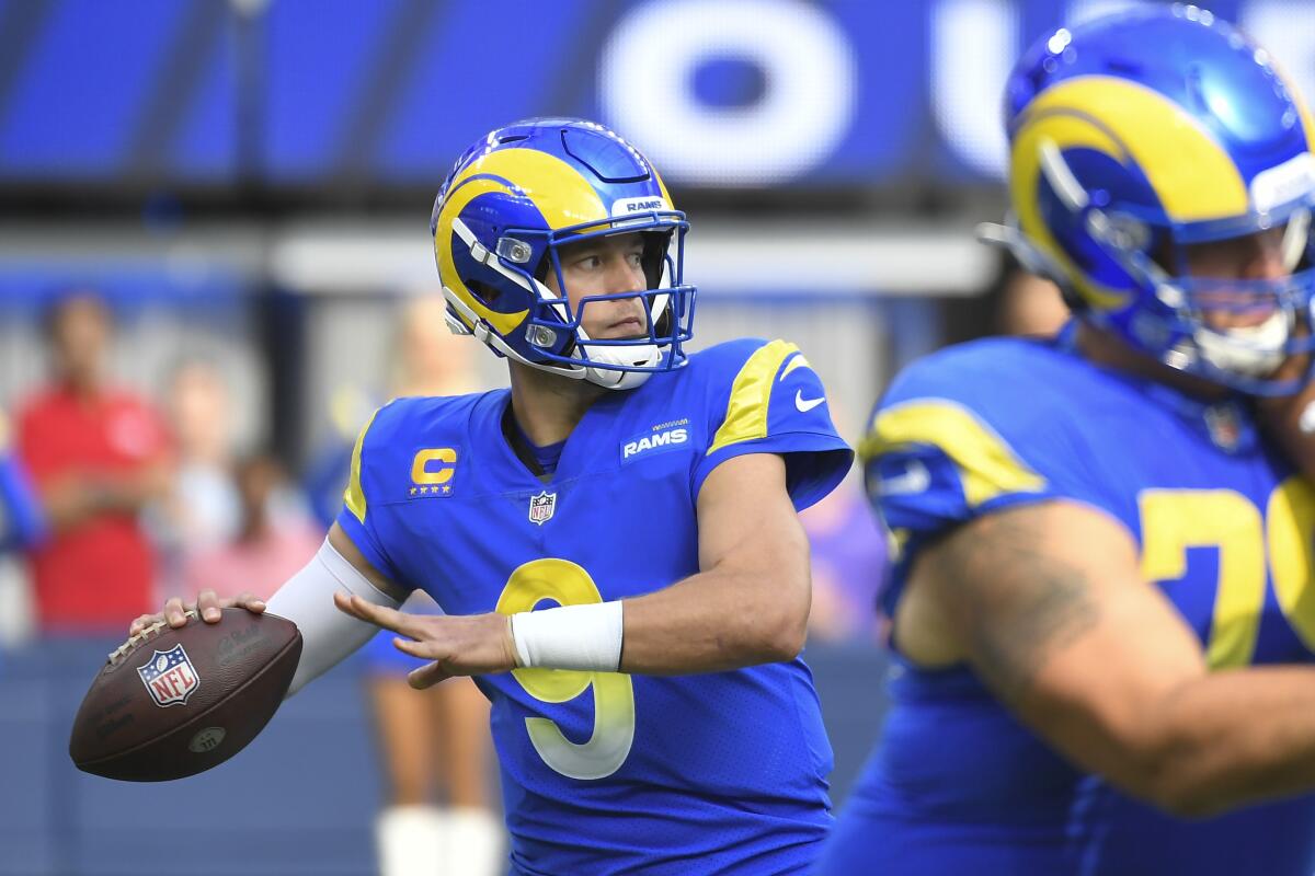 Rams quarterback Matthew Stafford throws a pass during the first half.