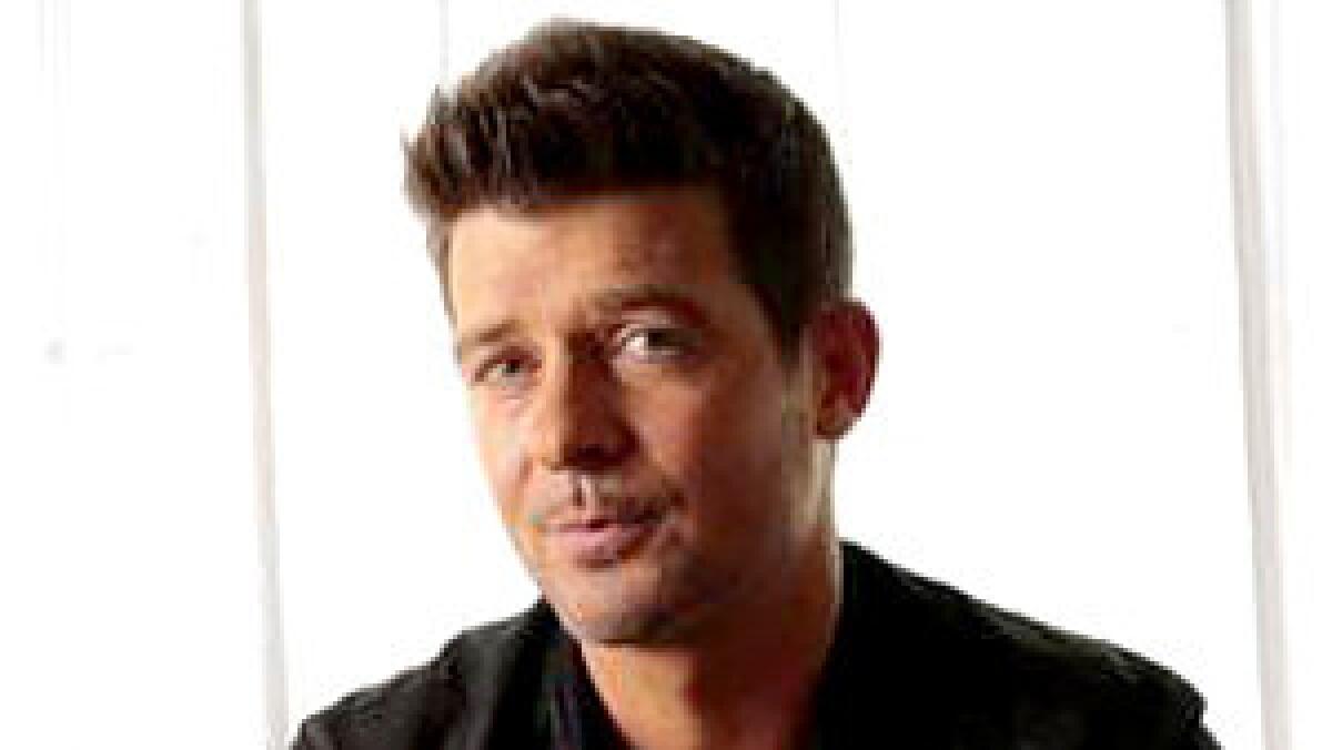 Robin Thicke has a new album, "Blurred Lines," which comes out July 30, 2013.