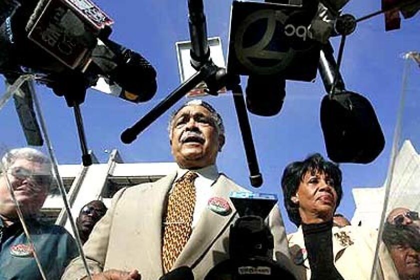 Assemblyman Mervyn Dymally (D-Compton), center, and U.S. Rep. Maxine Waters (D-Los Angeles) hold a news conference at the hospital, where a patient died Thursday.