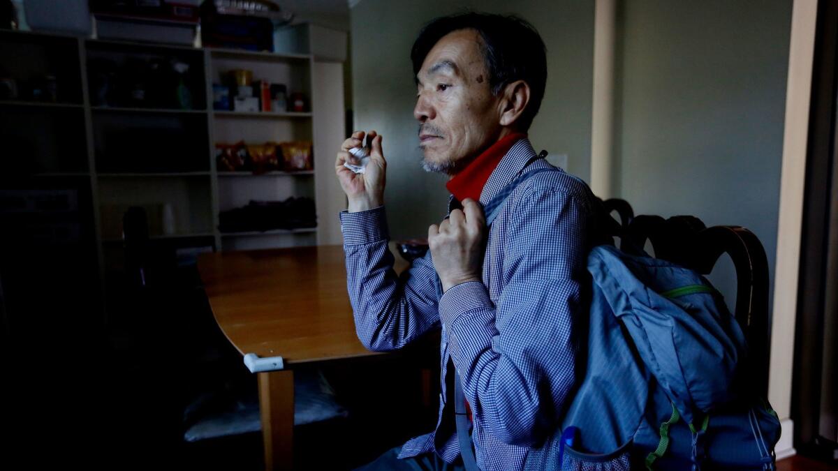 Seon Jin Kim, 62, is among the more than a dozen people living in an unofficial homeless shelter that the Rev. John Kim of St. James Episcopal Church has been running since 2009.