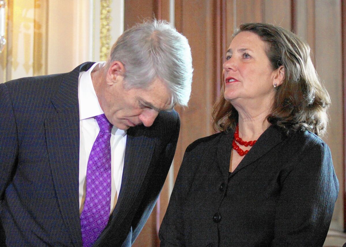Sen. Mark Udall (D-Colo.) speaks to Rep. Diana DeGette (D-Colo.) on Capitol Hill.