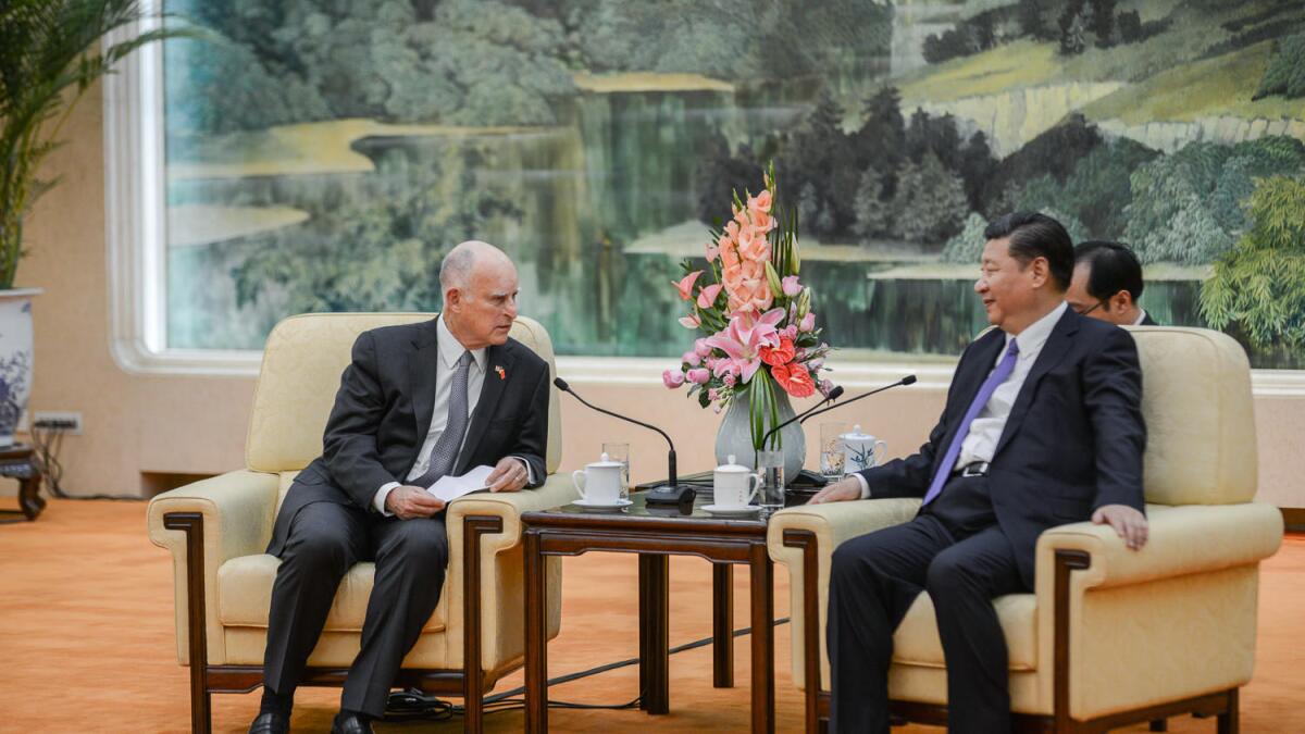 Gov. Jerry Brown and Chinese President Xi Jinping meeting in Beijing in June 2017.