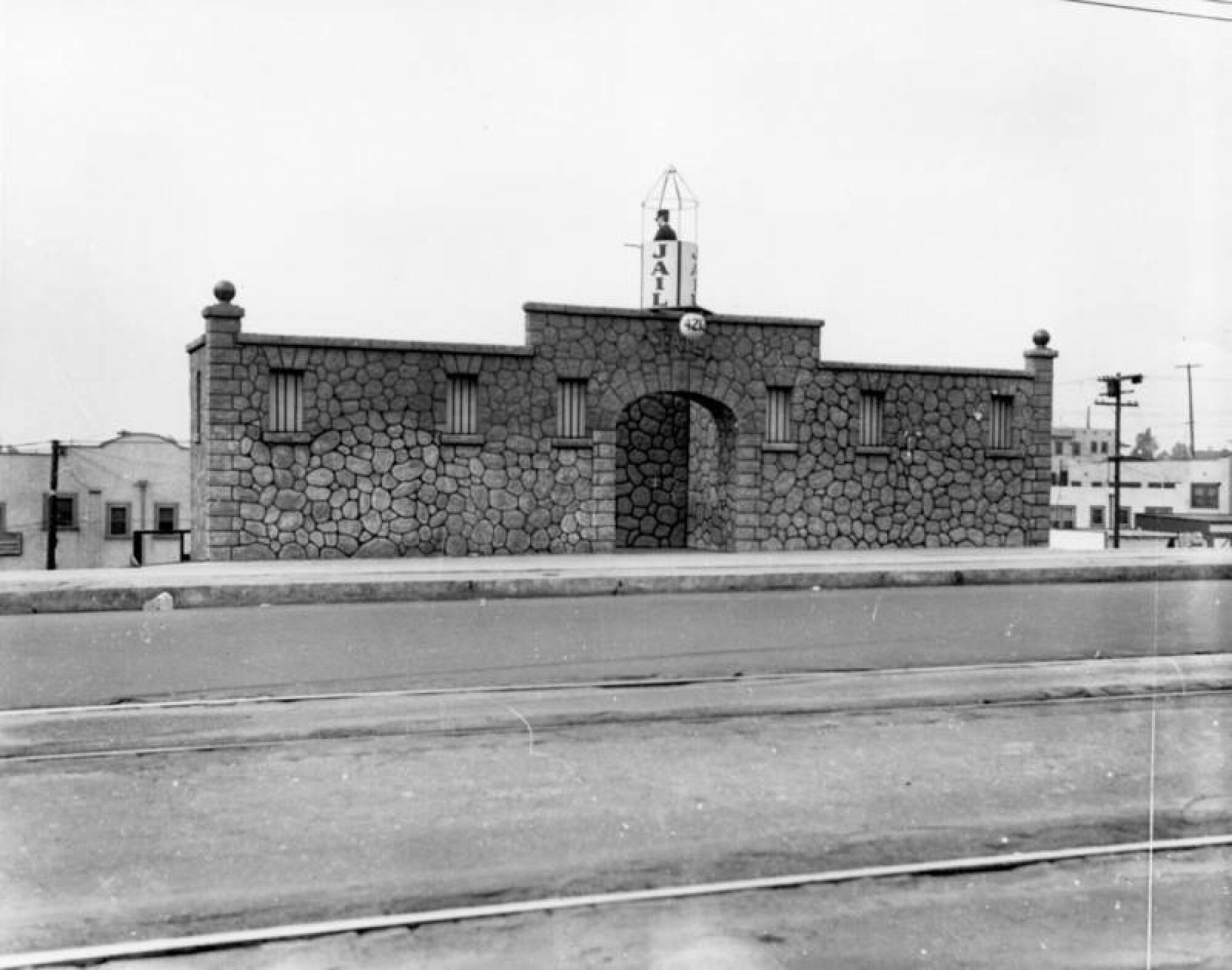 Exterior view of the Jail Cafe. A "jailer" watches from a guard tower on the roof.