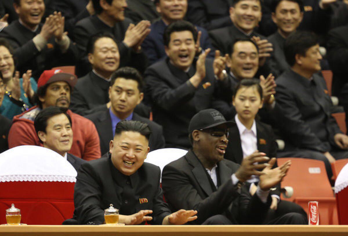 North Korean leader Kim Jong Un, left, and former NBA star Dennis Rodman watch North Korean and U.S. players in an exhibition basketball game at an arena in Pyongyang, North Korea.