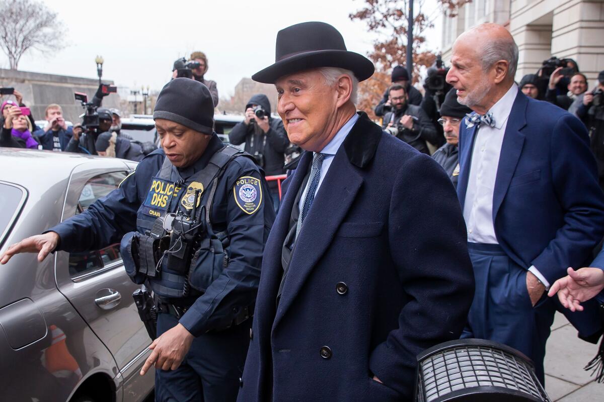 Roger Stone leaves federal court in Washington.