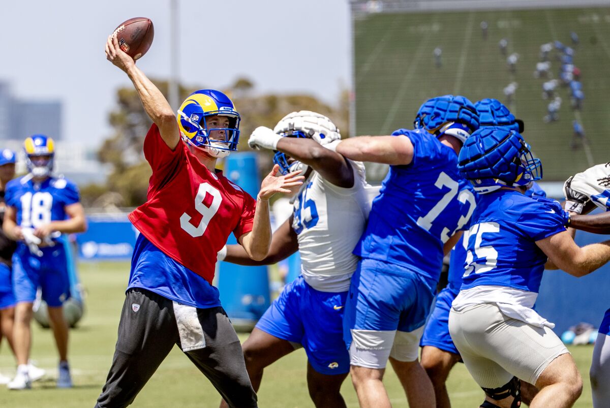 Rams quarterback Matthew Stafford passes at training camp on Sunday.