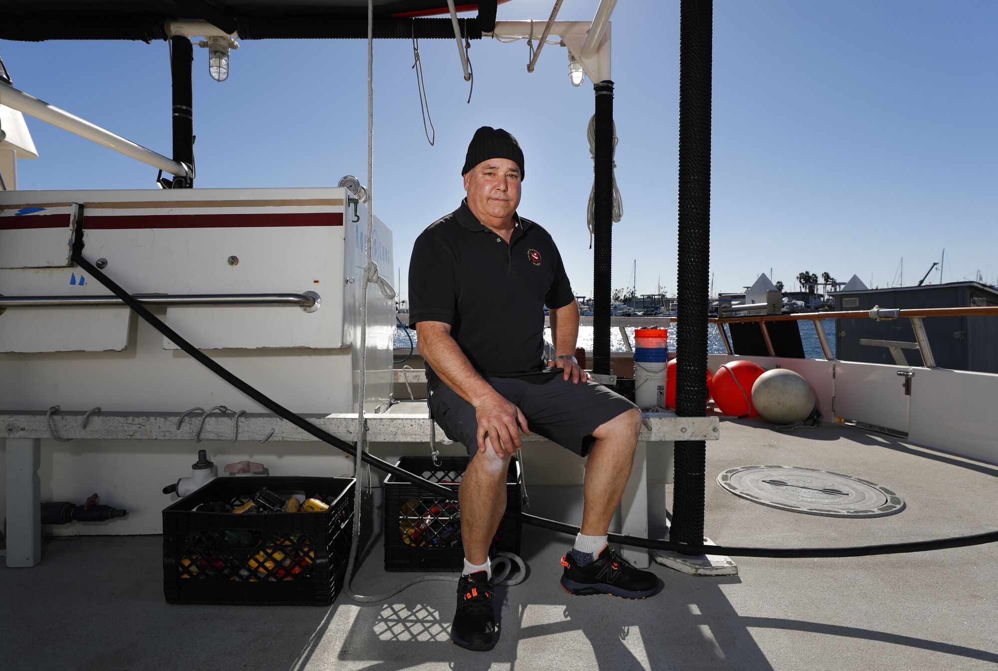 Cary Humphries sits on the deck of a boat