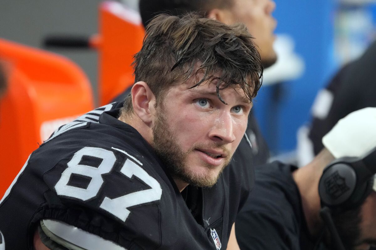 FILE -Las Vegas Raiders tight end Foster Moreau (87) watches from the sideline during the first half of an NFL football game against the Kansas City Chiefs, Saturday, Jan. 7, 2023, in Las Vegas. NFL free-agent tight end Foster Moreau was diagnosed with Hodgkin’s lymphoma during a physical with the New Orleans Saints, he posted Wednesday, March 22, 2023 on Twitter.(AP Photo/Rick Scuteri, File)