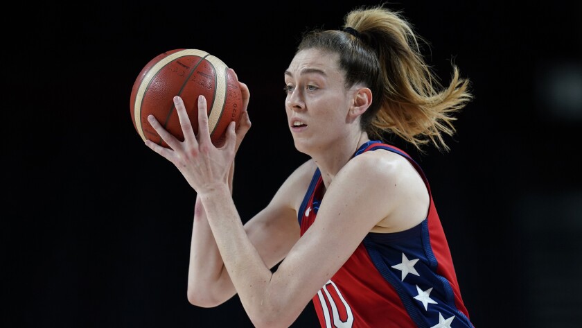 Breanna Stewart controls basketball during the victory over Australia at the Tokyo Olympics.