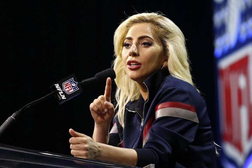 Lady Gaga responds to a question during a Super Bowl halftime show news conference on Thursday in Houston.
