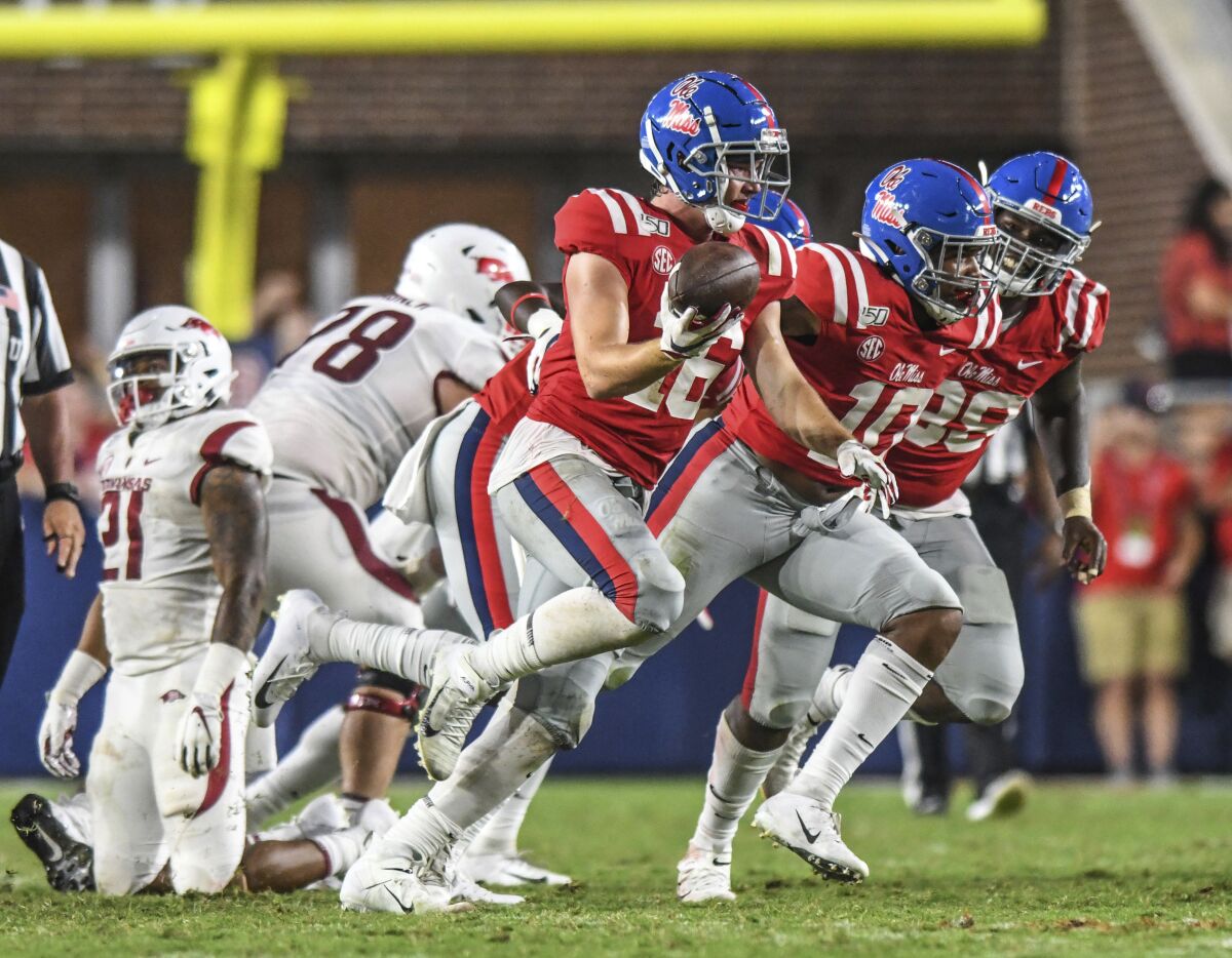 FILE -Mississippi linebacker Luke Knox (16) celebrates a fumble recovery against Arkansas during an NCAA college football game Saturday, Sept. 7, 2019, in Oxford, Miss. Knox, who appeared in 23 games at Ole Miss before joining the Panthers, has died, the university said. Knox died Wednesday, Aug. 17, 2022, school officials said. The cause was not revealed, though the university said early Thursday that police “do not suspect foul play."(Bruce Newman/The Oxford Eagle via AP)