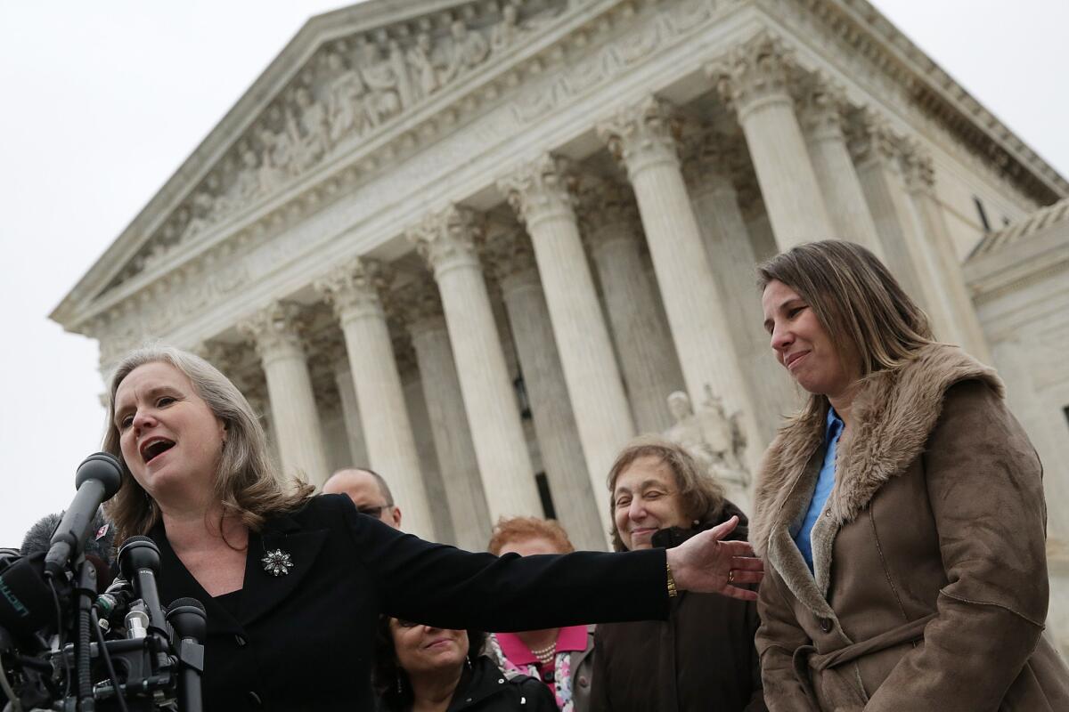 Peggy Young, right, the plaintiff in Young vs UPS, and her attorney Sharon Fast Gustafson answer questions outside the U.S. Supreme Court after the court heard arguments in her case Wednesday.