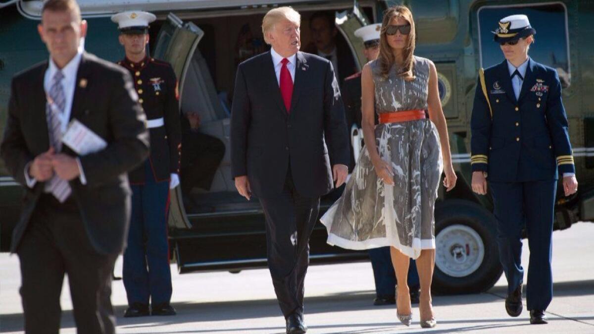 President Trump and First Lady Melania Trump walk toward Air Force One after the G-20 summit in Hamburg, Germany, on July 8.