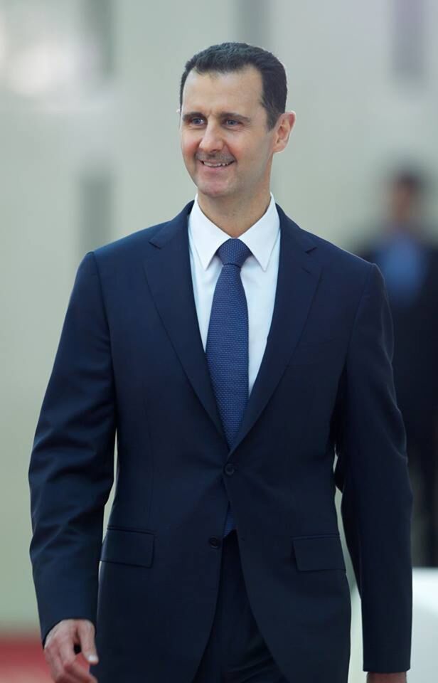 Syrian President Bashar Assad arrives at a dinner event in Damascus on the last week of the Muslim holy month of Ramadan.