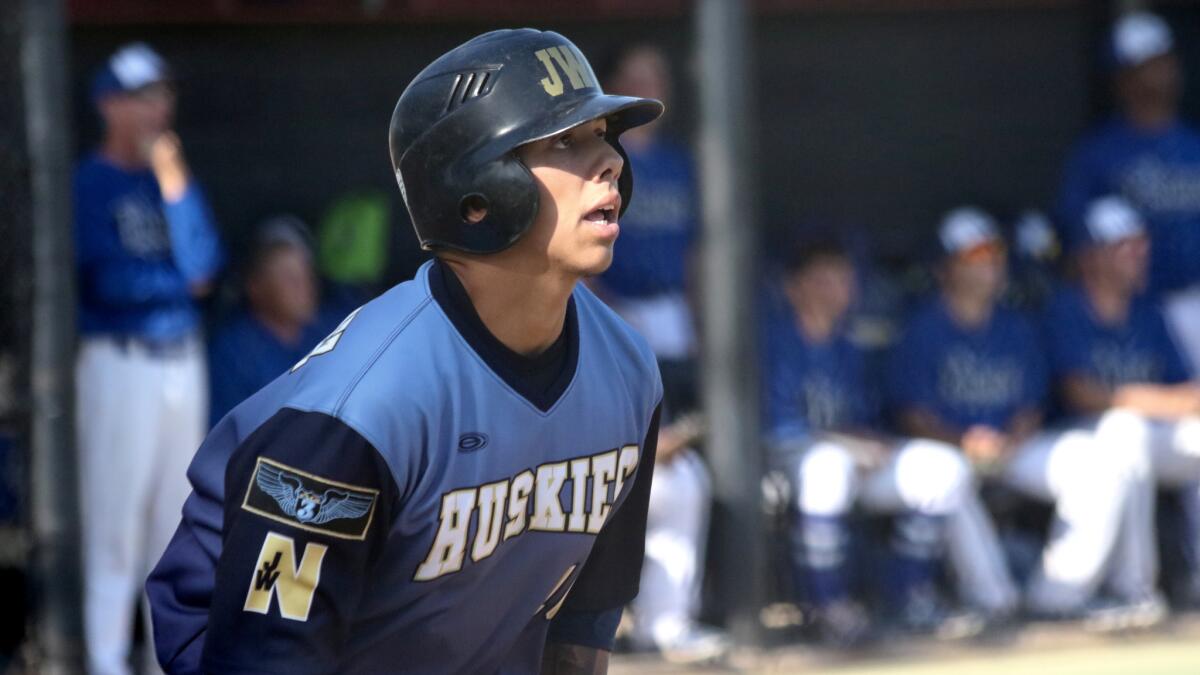 Riverside JW North shortstop Shane Martinez watches his fly ball to right field that brought home a run against El Camino Real.