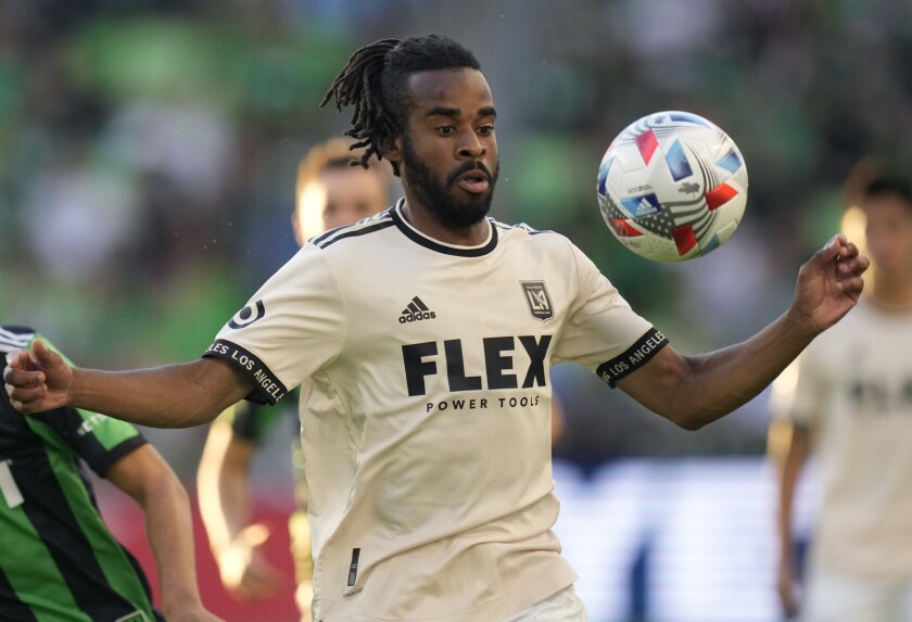 Los Angeles FC forward Raheem Edwards, right, moves the ball.