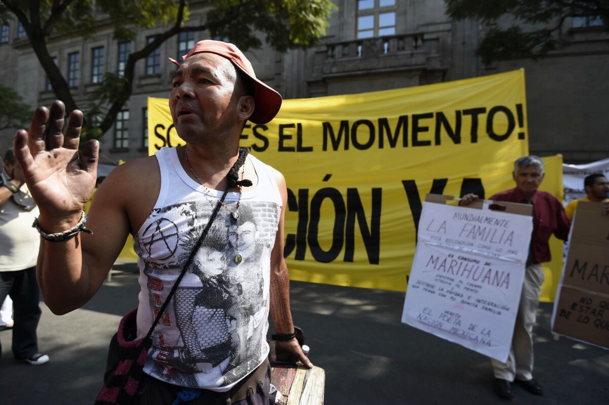 People demonstrate for and against the decriminalization of marijuana in front of the Supreme Court in Mexico City on Nov. 4, 2015.