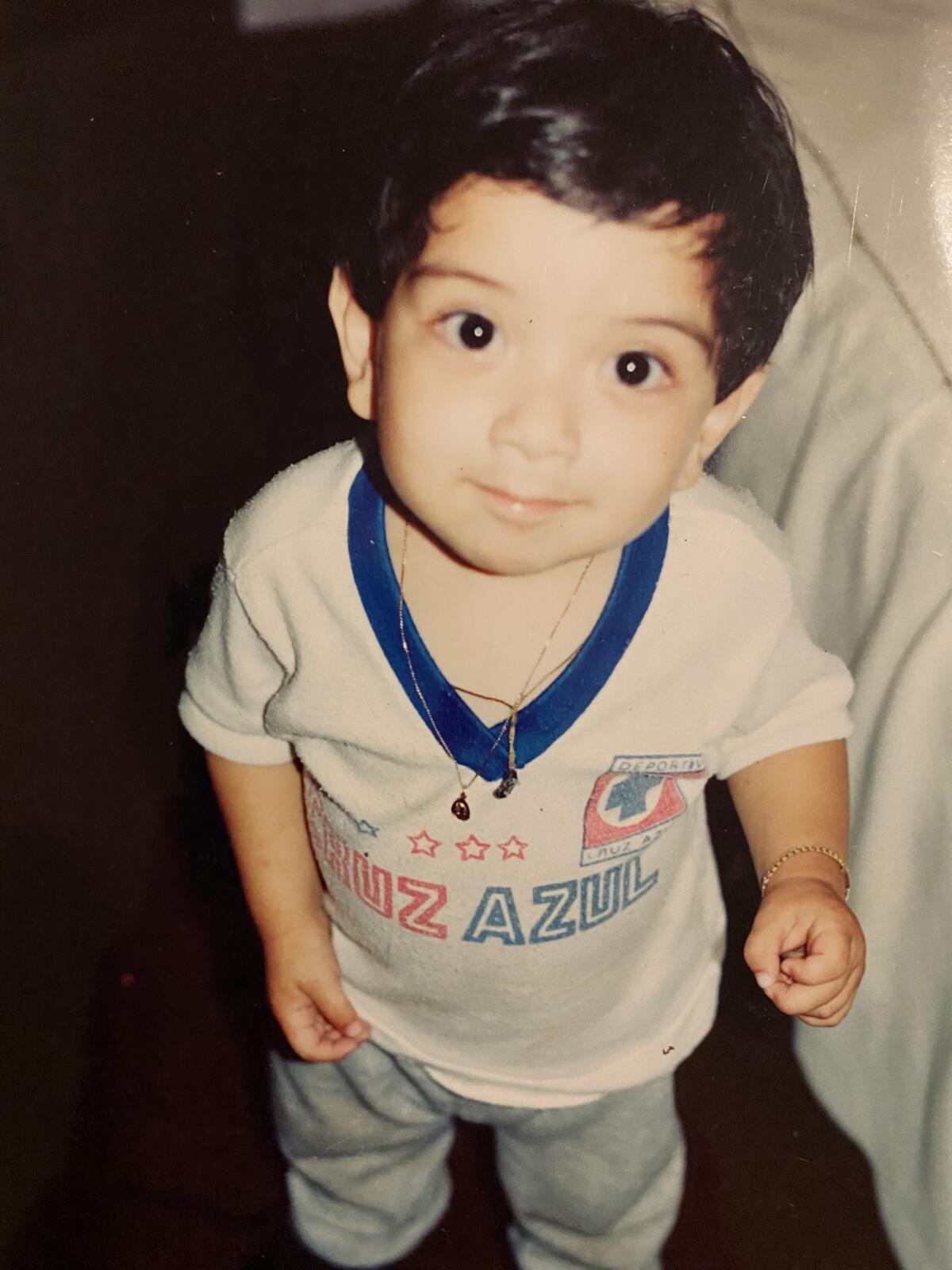 Reader Edgar Perez poses for the camera as a young child wearing a Cruz Azul shirt