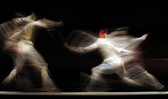 Italy's Andrea Baldini, right, competes against Germany's Richard Kruise during the Men's Individual Foil gold medal match at the European Fencing Championship in Plovdiv, Bulgaria.