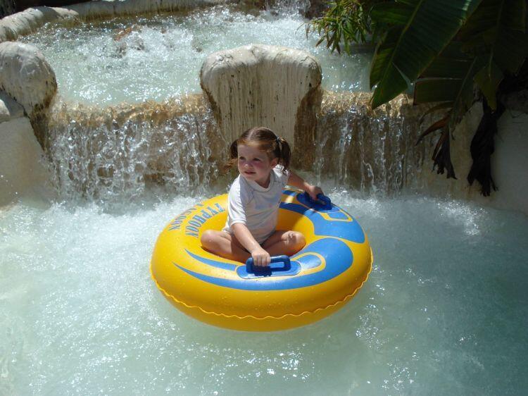 My daughter begins her journey on a scaled down tube ride in the Ketchakiddee Creek kids area at Typhoon Lagoon.
