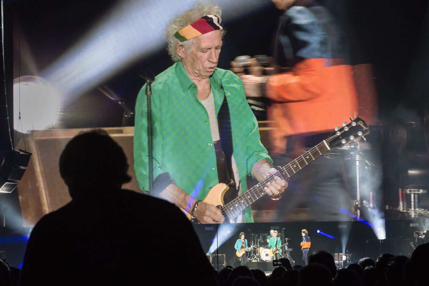 Guitarist Keith Richards appears on a jumbo video screen while performing with the Rolling Stones at