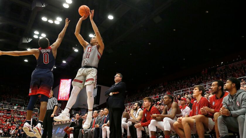 Stanford guard Dorian Pickens takes a 3-point shot over Arizona guard Parker Jackson-Cartwright during the second half.