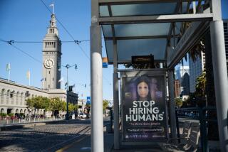 San Francisco, CA, United States - August 06: A bus stop advertises Artisan AI, an AI software company, along The Embarcadero in Downtown San Francisco on Wednesday, Aug. 6, 2025 in San Francisco, CA. After the downtown area saw an exodus of businesses and office workers during the pandemic, San Francisco's artificial intelligence boom is breathing new life into the city's economy. (Florence Middleton / For The Times)