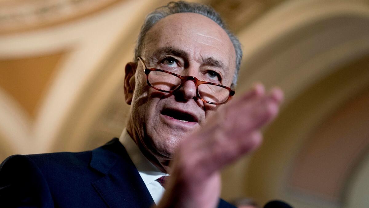 Senate Minority Leader Charles E. Schumer (D-N.Y.) speaks to reporters on Capitol Hill on Jan. 23.