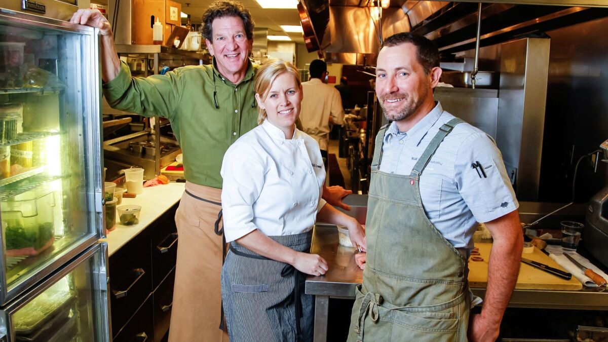 Chefs (from left) Jeff Jackson, Kelli Crosson, and Tim "TK" Kolanko in the kitchen at A.R. Valentien who cooked together for an Artisan Table dinner inspired by Kolanko's recent trip to Asia. Crosson is Jackson's chef de cuisine and Kolanko used to be.