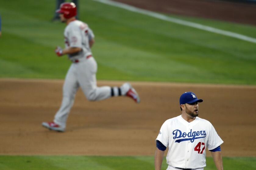 Cardinals outfielder Matt Holliday runs the bases after hitting a two-run home run off Dodgers starter Ricky Nolasco in the Dodgers' 4-2 loss in Game 4 of the National League Championship Series on Tuesday.