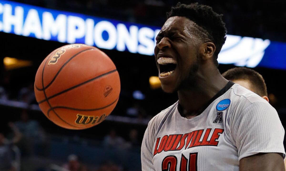 Louisville's Montrezl Harrell celebrates after scoring a basket while being fouled during the first half of the Cardinals' 71-64 win over Manhattan in the second round of the NCAA tournament on Thursday.