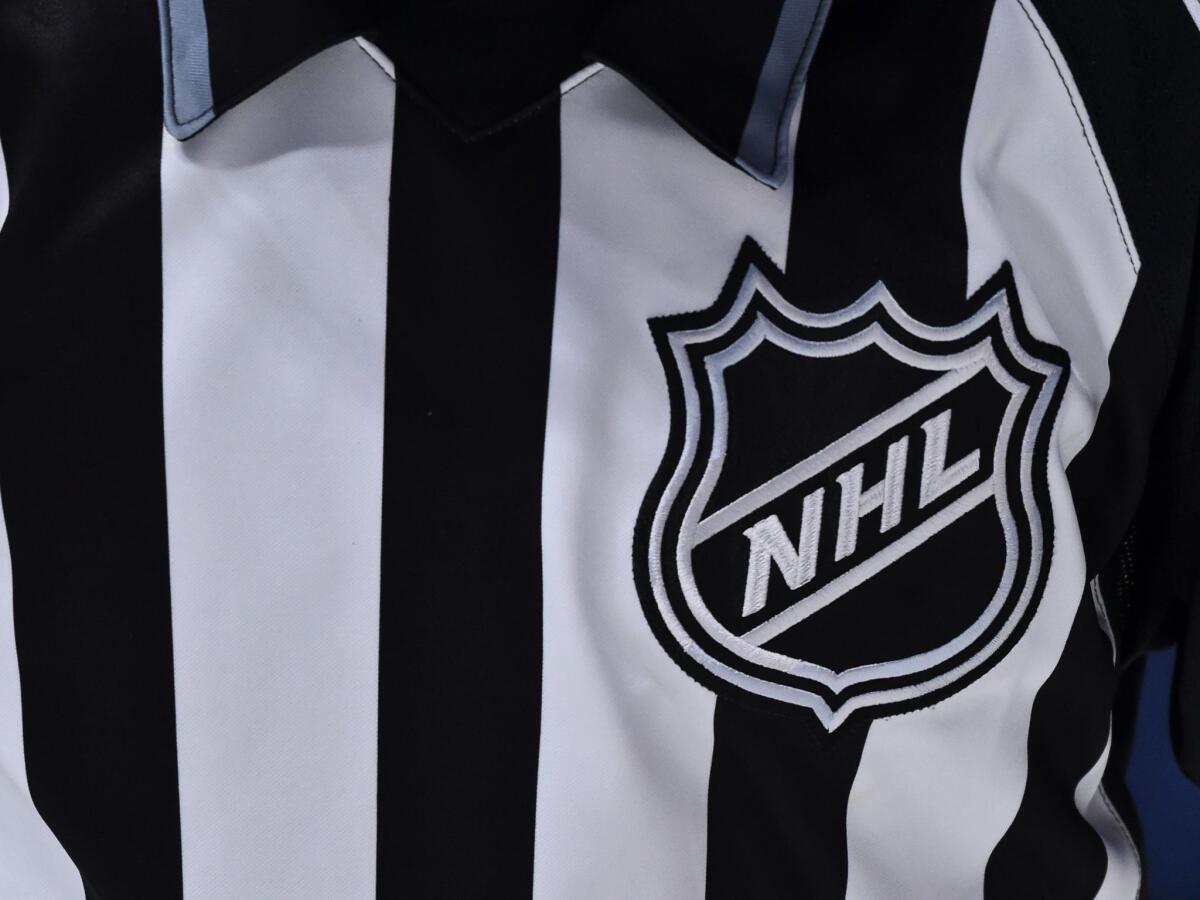 NHL logo on a referee's uniform.