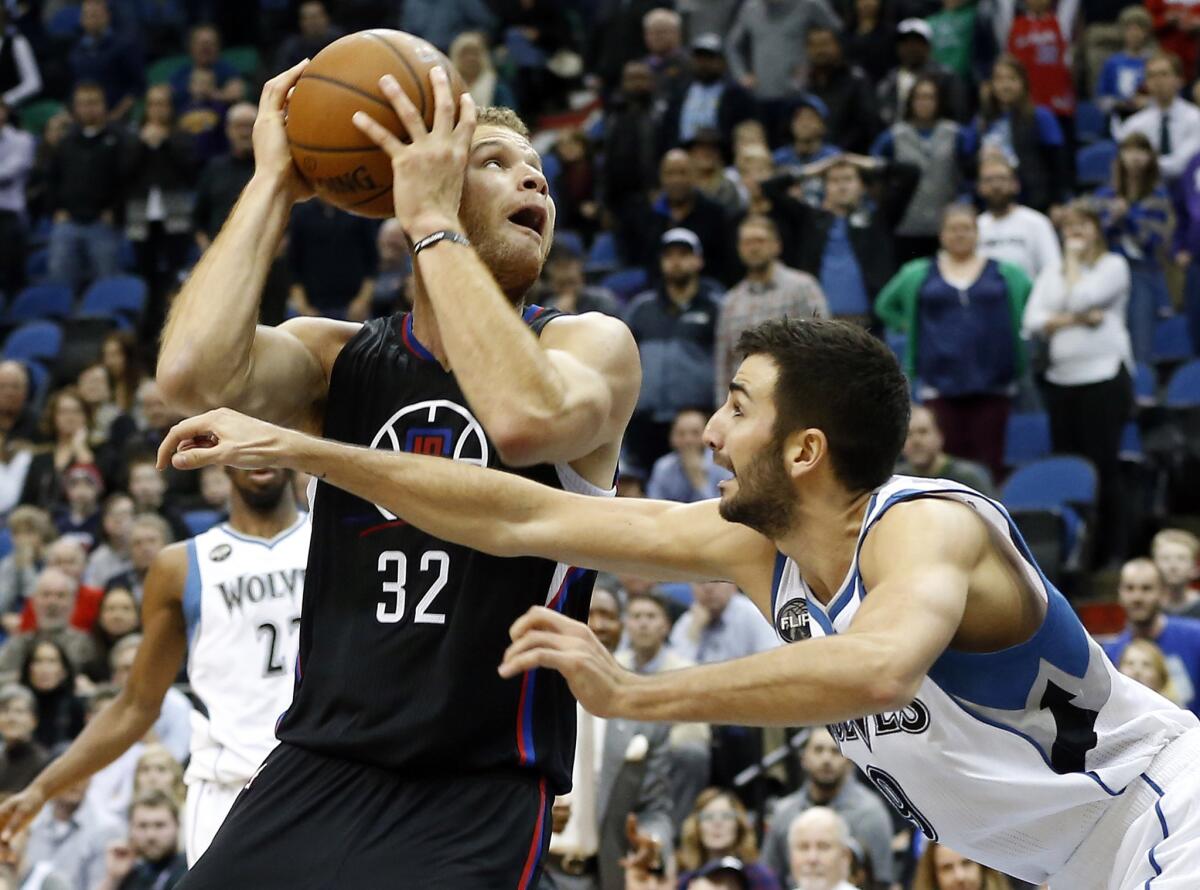Clippers power forward Blake Griffin (32) eyes the basket as Timberwolves guard Ricky Rubio defends in the second half on Dec. 7.