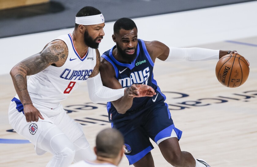 Dallas Mavericks forward Tim Hardaway Jr. battles Clippers forward Marcus Morris Sr.