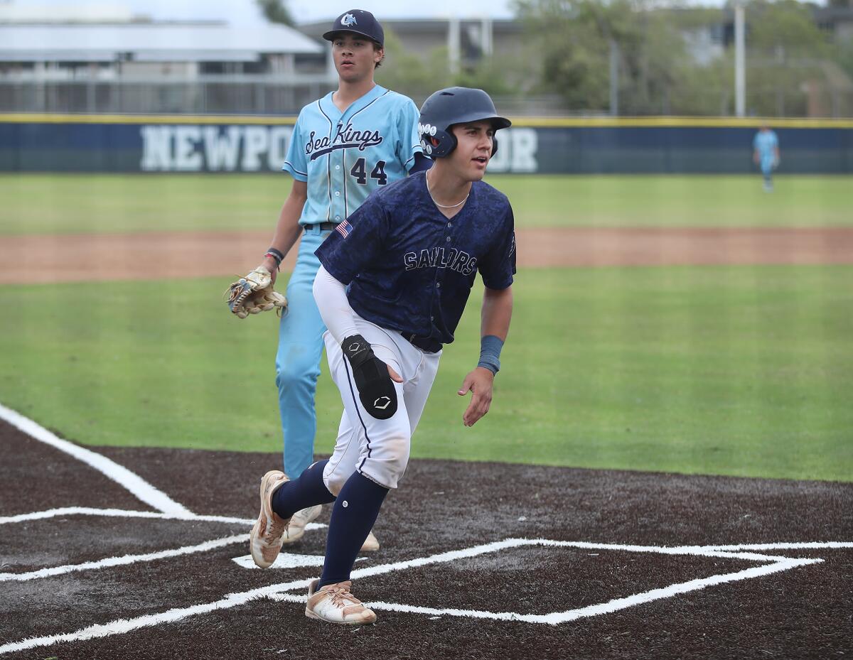 Newport Harbor's Lucas Perez runs across home for a score against CdM during Friday's game.