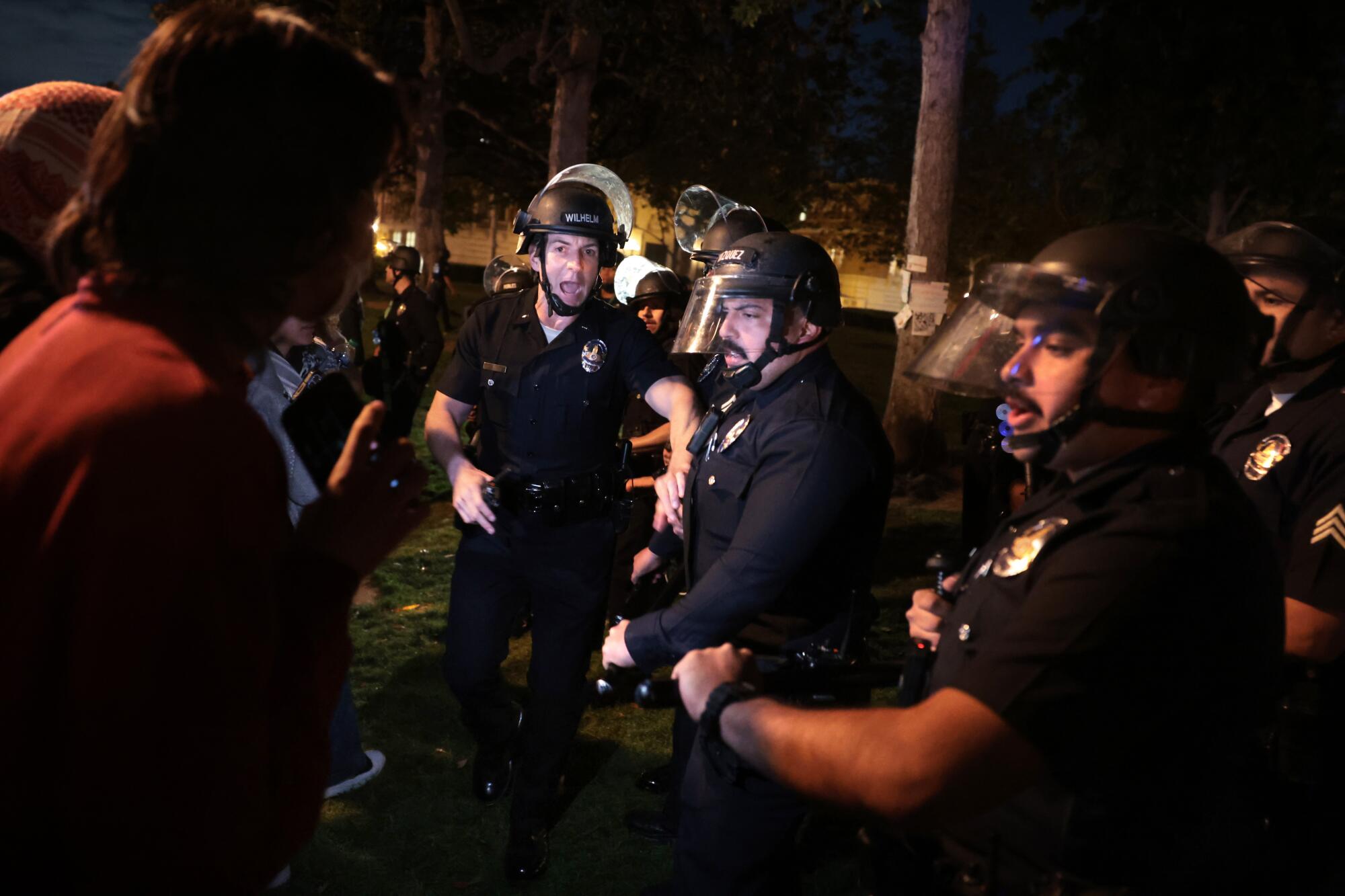 LAPD officers try to clear the USC campus after a demonstration against the Israel-Hamas war.