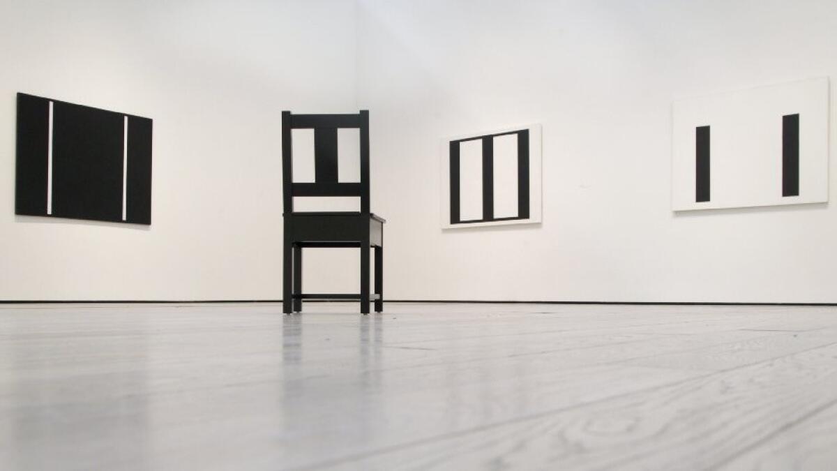 Abstract paintings by John McLaughlin (1898-1976) are echoed in a chair design by Roy McMakin.